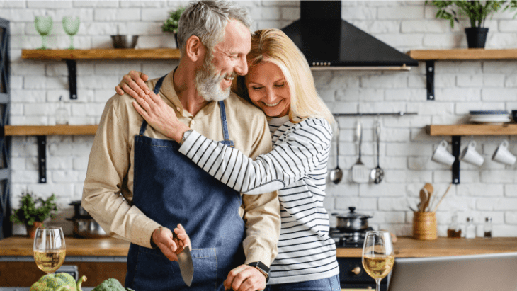 A couple preparing food in their kitchen